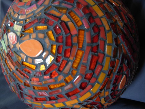 orange and red paisley gazing ball