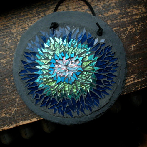 Helix Nebula Mosaic Mandala by Margaret Almon. Glass, dichroic and gold smalti on slate, 7"