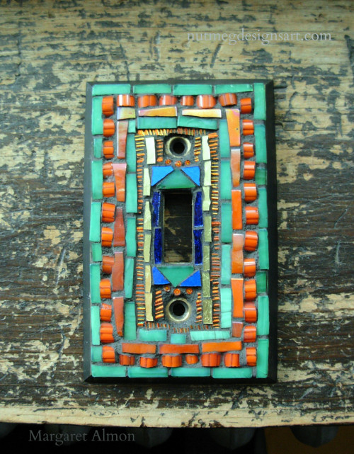 Mosaic Switchplate in Green, Orange and Gold, by Margaret Almon.