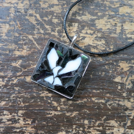 Film Noir Dove Pendant by Nutmeg Designs. Dove created by a Wayne Stratz and background mosaic by Margaret Almon.