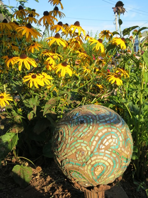 Black-eyed Susans in the Garden of Nutmeg Designs with Margaret's Mosaic Bowling Ball