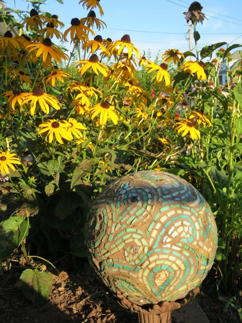 Black-eyed Susans in the Garden of Nutmeg Designs with Margaret's Mosaic Bowling Ball